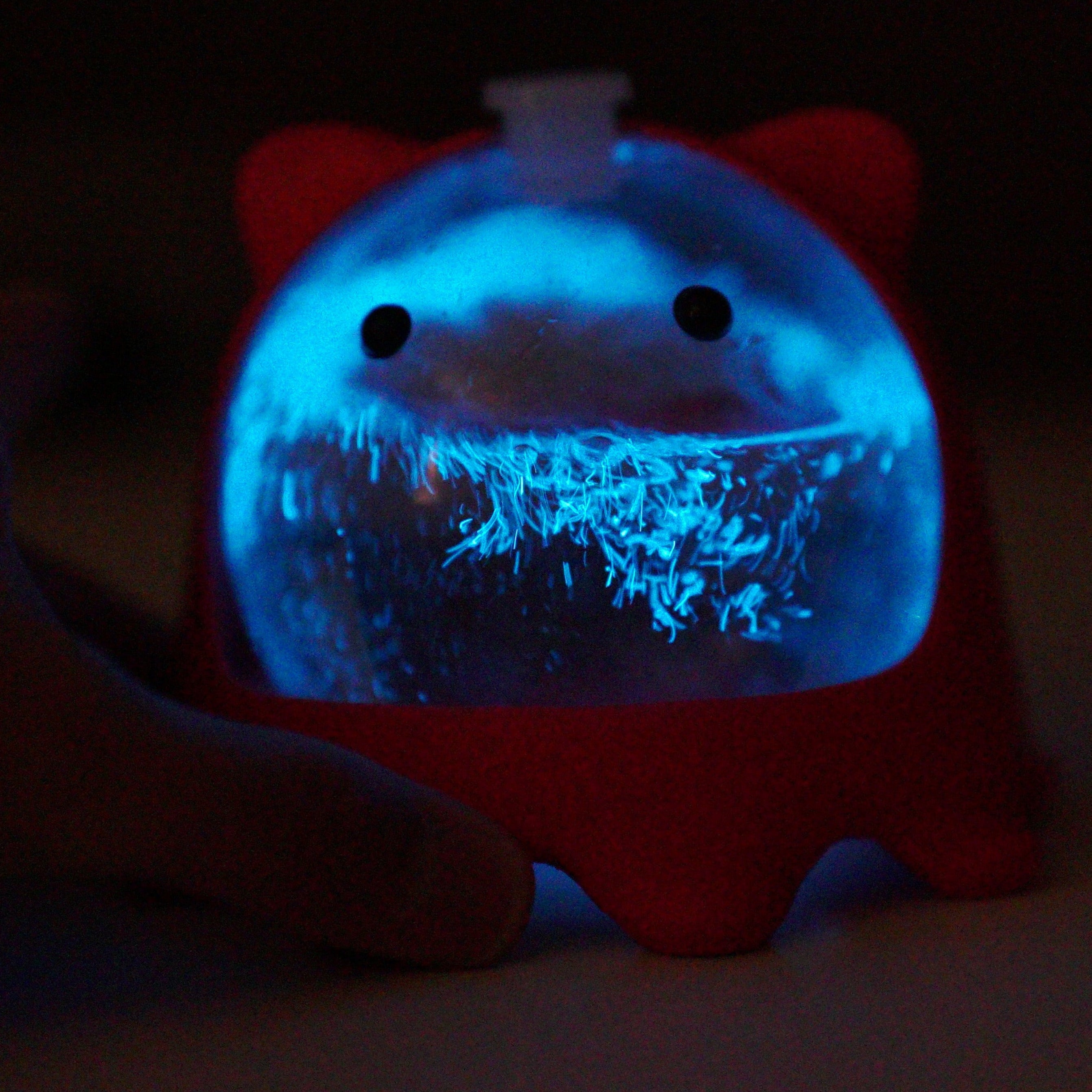 PyroPet Bio-Orb filled with PyroDinos bioluminescent plankton in custom 3D-printed creature stand