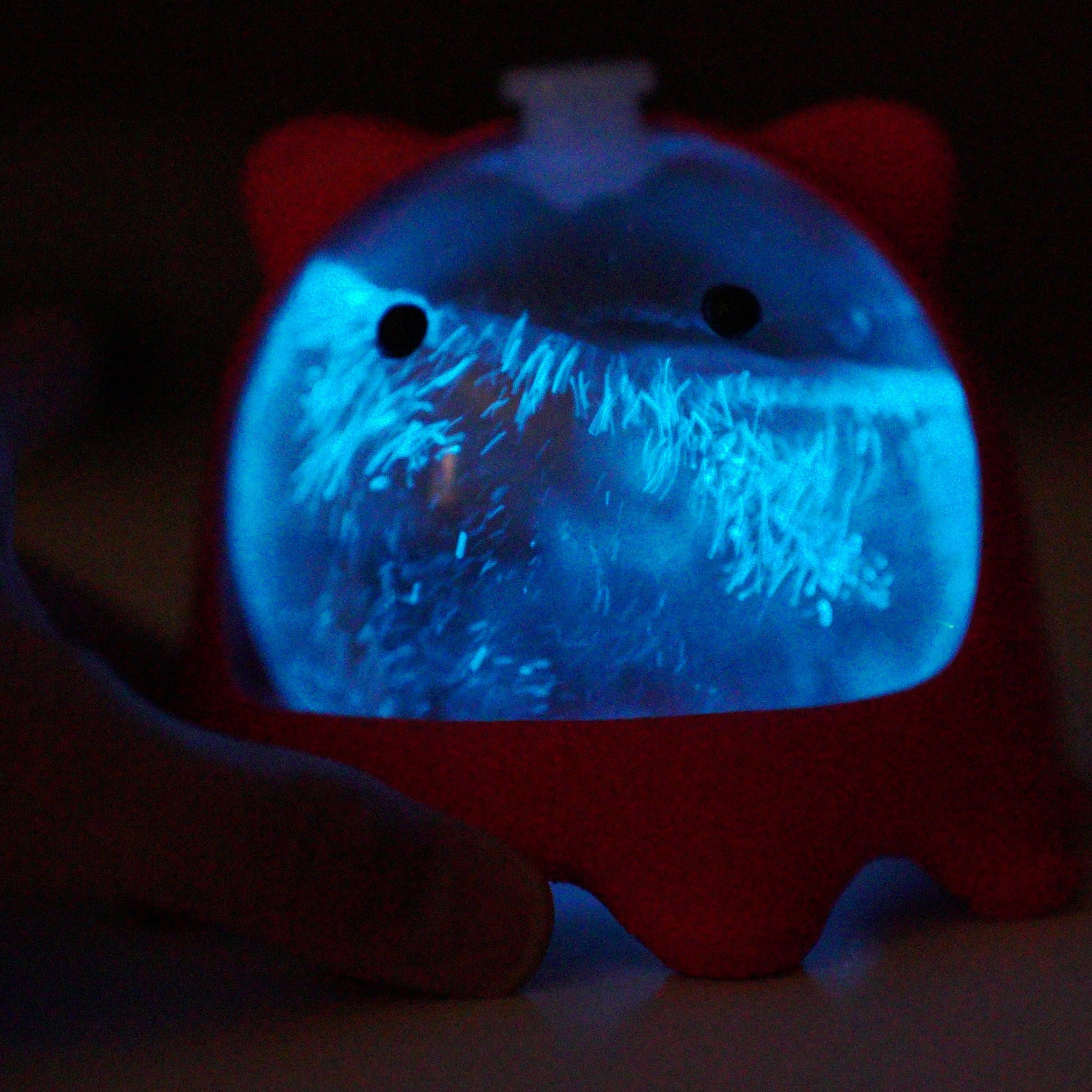 PyroPet Bio-Orb filled with PyroDinos bioluminescent plankton in custom 3D-printed creature stand