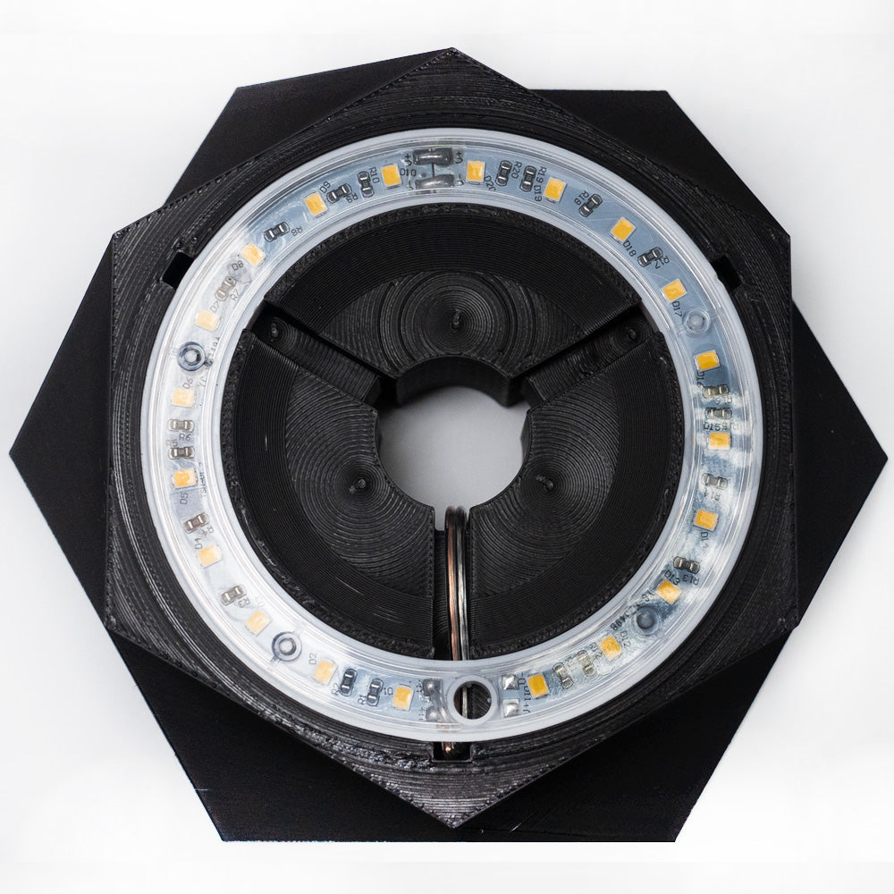 Close-up of the PyroDino LED light showing the black version
