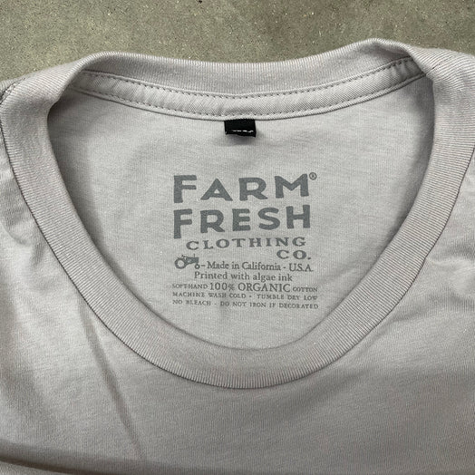 Pyrofarms ice (gray) t-shirt manufacturing tag. Farm Fresh Clothing Company made in California, U.S.A. Printed with algae ink. 100% organic cotton.