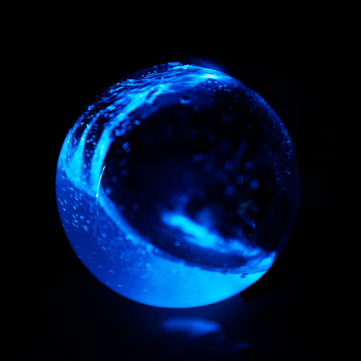 Bio-Orb filled with PyroDinos swirl at night bioluminescence 